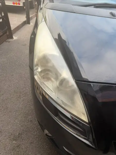 Before: a Peugeot headlamp lens gone cloudy and yellow